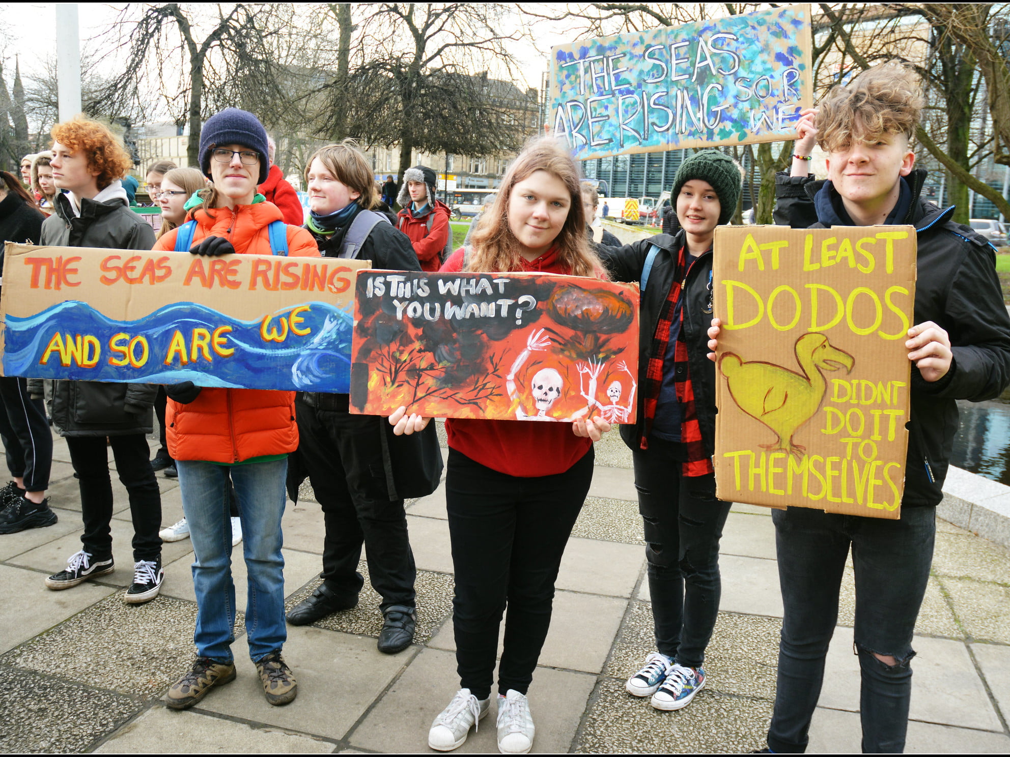 young people with banners